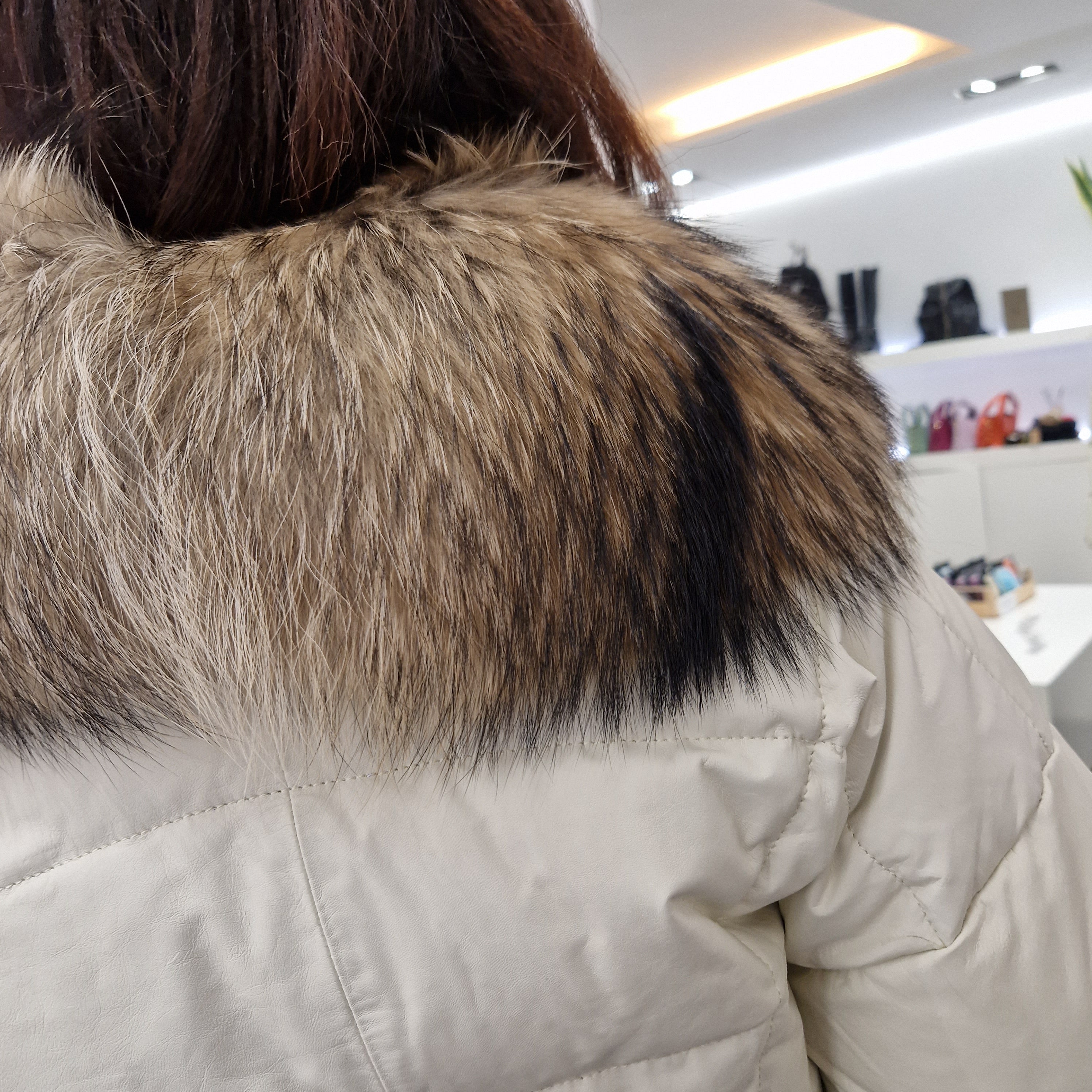 Leather down jacket with real fur collar